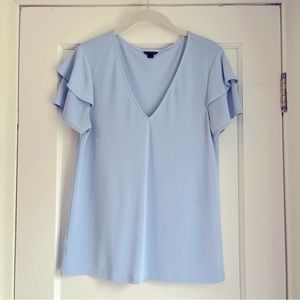 Light blue ruffle-sleeve top